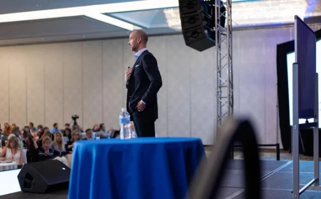 Steve Olson speaking on stage